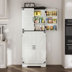 a white cabinet with sliding doors in a kitchen