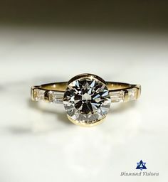 a close up of a diamond ring on a table