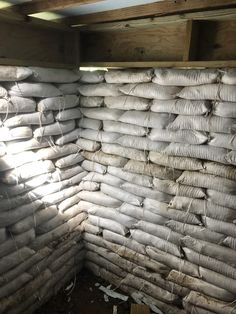 a pile of sand bags sitting inside of a building