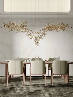 a dining room table with chairs and a chandelier hanging from it's ceiling