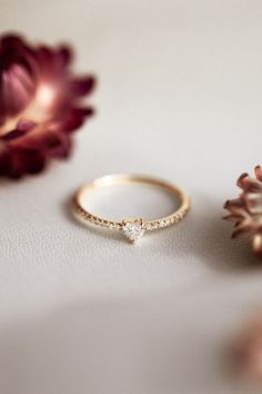 So this is what it feels like to fall in love... The Pavé Heart Diamond Stacker has a dainty heart shaped diamond on a pavé diamond band and she'll have everyone swooning over your stack! #ctwf Dainty Heart Cut Stackable Promise Rings, Heart Cut Stackable Rings For Promise, Dainty Heart Cut Diamond Promise Ring, Dainty Diamond Heart Promise Ring, Dainty Heart-cut Diamond Ring, Dainty Heart Ring With Diamond Accents For Promise, Dainty Heart-shaped Diamond Ring, Dainty Diamond Heart Cut Ring, Dainty Heart Cut Ring With Diamond Accents