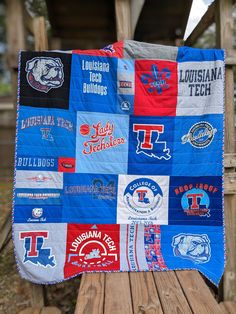 a quilt made to look like it has many different college logos and colors on it