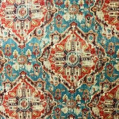 an old rug with many different colors and patterns