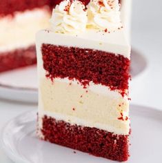 a slice of red velvet cake with white frosting