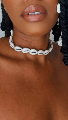 This cowrie choker features a fresh and exotic feeling, exuding your inner Goddess.   Known to bring forth good fortune and richness in your life, this is a perfect addition to your day-to-night styles.  Natural Kenyan handmade choker with a screw clasp. Cowrie Shell Necklace, Earthy Aesthetic, Handmade Chokers, Pearl Beach, Shell Choker, Boho Choker, Handmade African, Necklace Beaded, Shell Necklace