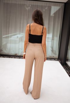 Pleated pants Belt loops Two pockets on the sides Two fake pockets on the back Fastener and zipper Sizes : S - M - L S : Length 42 inches - Width 13.4 inches M : Length 42.9 inches - Width 14.2 inches L : Length 43.7 inches - Width 15 inches Marine is 5'6, Ophélie is 5'6 and both wear a size S Contexture : 96% polyester / 4% spandex Handwash only Costume Beige, California Sweater, Pleated Pants, Black Mesh, Fur Jacket, Black Blouse, Women Clothes Sale, Clothes For Sale, Fitness Models