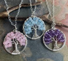 "These  Tree of Life Pendant necklaces are wire wrapped with gorgeous AAquamarine, Pink rose Quartz, Amethyst  and  .925 Sterling Silver wires for the outer ring & 99.9 % fine silver wire for the tree trunks an branches.  These lovely necklaces are smaller in sizes. They are slightly larger than US quarter coin.  please choose the desired tree necklace in the drop down menu. ~~The pendants measures about between 1.25 to 1.30 inch in diameter.  ~~The pendant  comes on a .925 Sterling Silver cable chain & finished with a lobster clasp. ~~  Each pendant is handmade, so please allow slight variations from the shape of the branches and placement of the stones as shown The Tree of Life is a universal symbol found in many spiritual traditions around the world. The tree of knowledge, connecting to Celtic Knot Necklace, Star Garnet, Amethyst Healing, Pink Rose Quartz, Tree Of Life Necklace, Silver Tree, Tree Necklace, Rose Quartz Stone, Tree Of Life Pendant