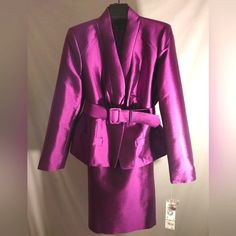 (* * * F I N A L S A L E * * *) *** Brand New With Tags *** *** Never Worn *** New York New York Wool/Silk Skirt Suit Brand: Anne Klein Color: Imperial Purple Size: 12 Usa Classic Fit Anne Klein Imperial Purple Wool/Silk Skirt Suit Jacket: Shawl Collar With Matching Fabric Belt, Long Sleeve, Double Snap & Button Front Opening Skirt: Straight, Knee-Length, No Pockets, Hook & Eye Rear Closure With Invisible Zipper, Rear Kick Pleat 66% Wool/ 34% Silk Full Acetate Lining Dry Clean Only *** Never Wor Purple Silk Sets For Formal Occasions, Elegant Belted Sets For Spring, Chic Fitted Belted Sets, Fitted Silk Skirt Suit For Work, Fitted Belted Sets For Spring, Imperial Purple, Blue Suit Jacket, Red Blazer Jacket, Skirt Straight