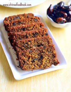 some food is on a white plate and next to other plates with raisins