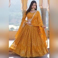 Yellow Sequins Embroidered Georgette Lehenga Choli - 38 Description: * 3 pieces (lehenga, choli, dupatta) *  New & No known flaws * Type of work: Embroidered, Resham, Sequins and Thread Work * Top: Padded blouse * Bottom: cancan skirt under lehenga * Fabric: Lehenga - Georgette, Blouse - Georgette, Dupatta - Georgette Size: * Blouse bust size: 38 (2 inches extra cloth on both sides if needed to open) * Length of lehenga / skirt: 42 inches Fitted Chinon Choli For Navratri, Fitted Chinon Lehenga For Diwali, Georgette Sets With Pallu For Navratri, Fitted Sets With Gota Work For Navratri, Semi-stitched Gota Work Sets For Navratri, Yellow Embroidered Lehenga In Chinon, Bollywood Style Georgette Set With Pallu, Fitted Choli With Dupatta In Chinon, Fitted Chinon Lehenga With Pallu