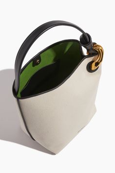 The JW Anderson Corner Bucket Bag will be a staple in your spring and summer wardrobe. This bucket bag is crafted in canvas with their signature chain detail. Bucket bag Top handle Open top Leather piping H: 31cm / W: 23cm / D: 18cm Outer: 80% Cotton, 20% Full Grain Calf Leather Lining: 100% Recycled Cotton Jw Anderson Bag, Bags Inspiration, Basket Bags, Dream Bags, Diamond Bar Necklace, Leather Bag Pattern, Bucket Bags, Best Handbags, Luxury Purses