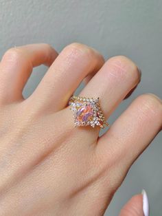 This gorgeous, timeless ring features our favorite Morganite design and hand picked crystals. This is a 2 piece set. ✦ DETAILS ✦ ✧ Handcrafted ✧ 1.60 Carat center stone ✧ Morganite and crystals ✧ Sizes 3.75-11.25 ✧ Sterling Silver 925 ✧ This ring will arrive ready to gift in a Kherish Jewelry Pouch. ✧ PRE-ORDER: Items that are preorder only will ship within 10-15 business days. You will receive an email with the updated processing time if you order a size/option that qualifies for pre-order. ✧ D Morganite Ring Set, Timeless Ring, Morganite Ring, Jewelry Birthday, November Birthstone, Matching Band, Anniversary Gift For Her, Jewelry Creation, Jewelry Pouch