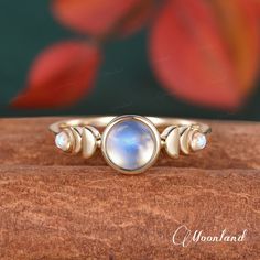 "14K Gold Bezel Moonstone Engagement Ring Phases of the Moon Wedding Ring Yellow Gold Stacking Ring Celestial Minimalist Jewelry Women Ring Check the Rose Quartz ring: https://www.etsy.com/listing/1436299442 🌙 Product Details -Center Stone: 6mm Round Natural Moonstone, Top AA Grade -Side Stone: 2mm Round Moonstone -Ring Band: 1.8mm -Metal Choice: 10K, 14K or 18K Solid Gold (Rose, White, or Yellow)  **Handmade in the US The making process is about 3-4 weeks!! 🌙 Ring Box(Limited time US$1): Get Crescent Moonstone Anniversary Ring, Crescent Moonstone Ring For Anniversary, Moon Shaped Moonstone Wedding Ring, Wedding Crescent Moonstone Ring With Moon Phase, Minimalist Moonstone Moon-shaped Ring, Gold Moonstone Ring With Moon Phase For Wedding, Celestial Moonstone Ring With Moon Phase For Wedding, Minimalist Wedding Ring With Moon Phase, Minimalist Wedding Rings With Moon Phase Detail