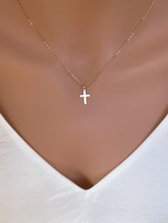 Dainty 14k Gold fill Cross Necklace Woman. Super cute small cross necklace is great gift for her Christmas, This necklace is made of.... -14k gold fill 15mm cross pendent, and -14k gold fill cable chain with spring clasp, -Come up with beautiful ribbon gift box and -One set of Care instruction package. MORE CROSS JEWELRY https://www.etsy.com/shop/rainbowearring?search_query=CROSS MORE LAYERED NECKLACES https://www.etsy.com/shop/rainbowearring1?section_id=17891444&ref=shopsection_leftnav_5 CO Minimalist Cross Charm Necklace With Delicate Chain, Minimalist Cross Pendant Charm Necklace, Simple Cross Jewelry With Delicate Chain, Simple Yellow Gold Cross Necklace, Minimalist Cross Necklace With Delicate Chain Crucifix, Minimalist Crucifix Cross Necklace With Delicate Chain, Minimalist Crucifix Jewelry With Delicate Chain, Simple Cross Clavicle Chain Jewelry, Simple Clavicle Chain Cross Jewelry