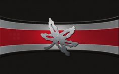 a black and red wallpaper with a silver dragon on it's back side