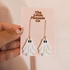 👻✨Pearly glittery white ghosties feature a 2 inch gold plated dangle with gold plated hypoallergenic attachments and a rubber backing. Not to be worn in shower or pool to extend lifetime. White Novelty Jewelry For Party, Novelty White Jewelry For Party, White Novelty Party Jewelry, White Dangle Jewelry For Halloween, White Halloween Party Jewelry, Spooky White Earrings For Party, White Drop Earrings For Halloween, White Spooky Earrings For Party, Spooky White Halloween Jewelry