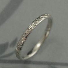 a silver ring with filigrees on it