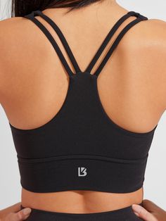 The Bloom Sports Bra is a long-line sports bra with a flattering sweetheart neckline and a light to medium level of support to highlight your best features. It has thick front straps leading to a strappy back and a subtle sinch between the cups. This bra is made with our signature NuBre fabric for a soft, second skin feel with high stretch retention. Glute Bands, Bra Size Guide, Non Slip Socks, Athleisure Fashion, Black Sports Bra, Padded Bras, Sports Bra Sizing, Sports Leggings, Cross Straps