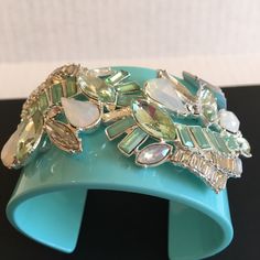 This Brand New Robin’s Egg Blue Color Bracelet Is Encrusted With Stones Of Varying Shapes: Pear, Marquis, Rectangular, Etc. An Absolutely Stunning And Unusual Bracelet. Approx 2” Wide. Best For Medium Or Large Wrists. Green Crystal Bracelet With Rhinestones, Green Crystal Bracelets For Party, Green Crystal Bracelet For Party, Green Rhinestone Bracelets For Wedding, Green Cuff Bracelet For Party, Adjustable Turquoise Crystal Bracelet For Parties, Elegant Turquoise Crystal Bracelet For Party, Adjustable Green Cuff Bracelet For Party, Adjustable Green Cuff Bracelet For Parties