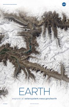 an aerial view of the earth with mountains and rivers in blue, brown and white