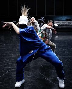 two dancers in blue pants and white headbands