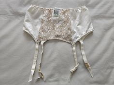 A Vintage NWT Suspender/Garter Belt by Warner's Lingerie from their lovely 'Richness' range, in size 10-12/Aus/UK, 5-6/US, in an all cream/taupe nylon and lace finish. Quadruple clasp on back and 4 suspenders. Colour - Off White Vintage Suspenders, Vintage Garter, Garter Skirt, Lingerie Vintage, Suspenders For Women, Garter Belts, Suspender Belt, Vintage Lingerie, Socks And Hosiery