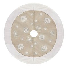 a round rug with snowflakes on the bottom and white trimmings around it