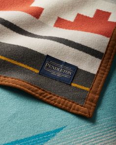 a close up of a blanket with a label on it