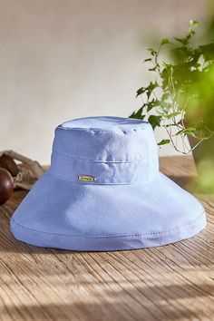 Handmade from lightweight and breathable cotton and branded with terrain exclusive details, this colorful crusher hat is perfect for a day at the beach or in the garden. Packable construction pairs with UPF 50 sun protection and an inner drawstring to assure a comfortable fit. | Cotton Crusher Hat in Purple at Terrain Adjustable Cotton Bucket Hat With Uv Protection, Adjustable Cotton Sun Hat With Uv Protection, Solid Color Cotton Sun Hat For Summer, Cotton Summer Sun Hat, Solid Cotton Summer Sun Hat, Blue Wide-brim Cotton Sun Hat, Blue Wide Brim Cotton Sun Hat, Blue Cotton Wide Brim Sun Hat, Comfortable Adjustable Beach Hats