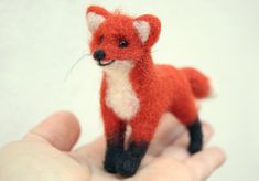 This little fox was lovingly needle felted from sheep's wool. Thanks to the integrated wire, the pose can be changed. length: approx. 11 cm Height: approx. 7 cm Materials used: sheep's wool, glass beads, nylon thread, wire Since this is lovingly handcrafted, each product is unique. There may therefore be slight variations in size, color, details or shape. But that makes everything unique❣️ Needle Felted Fox, Felt Fox, Art Textile, Felt Art, Sheep Wool, Favorite Things Gift, Needle Felting, Wedding Shop, Fiber Art