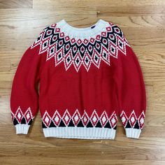 Beautiful vintage hand knit 100% cotton ski sweater.  Red, White and Black Geometric fair isle knit sweater by GAP in 1980s!   Measurements laying flat: 18" Chest 24" Length 26" Arm Length 15" Waist Item is in good used vintage condition for age and use.  There are some spots of thread pulls as seen in photos.  Please review all photos and the listing video provided for full details and description of item condition.  Thank you for visiting our shop!  Want to see more vintage finds from GrandmaG Cozy Red Cotton Sweater, Cozy Red Sweater For Cold Weather, Retro Knitted Sweater For Cold Weather, Red Nordic Sweater With Crew Neck, Red Nordic Crew Neck Sweater, Vintage Fair Isle Sweater For Cold Weather, Retro Knitted Sweater For Winter, Red Jacquard Knit Sweater For Winter, Red Fair Isle Sweater For Winter