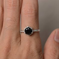 This is a gorgeous handmade creation. Its beauty is its simplicity & Elegance. The 7*7mm round cut natural black spinel is crafted in solid sterling silver and with rhodium plated. It is available to customized, if you have any mind, just let me know, we will discuss with it. All item is sent in a beautiful gift box You can realize more lovely stuff clicking the link https://www.etsy.com/shop/knightjewelry?refshopsection_shophome_leftnav Please leave the correct address and you PHONE NUMBER Classic Black Spinel Promise Ring, Elegant Black Spinel Diamond Ring As Gift, Classic Black Spinel Sapphire Ring For Anniversary, Elegant Black Spinel Rings For Gift, Classic Black Sapphire Ring For Gift, Classic Black Sapphire Ring In Sterling Silver, Classic Black Sapphire Ring As Gift, Elegant Round Onyx Diamond Ring, Black Spinel Sapphire Ring Gift