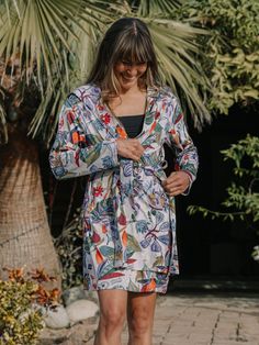 Our new Sun Robe is as at home as a poolside cover-up as it is in your hotel room. It’s light-packing and multi-tasking! Keep the sun off with our vibrant prints in a soft and luxurious UPF 50 poly spandex blend fabric, or have a leisurely breakfast on the front veranda in style. The Sun Robe makes a great gift idea for a home or holiday! Content: 95% polyester 5% spandex + Two Front Pockets+ Oversized Hood+ Waist Tie Summer Printed Sleepwear For Vacation, Printed Summer Sleepwear For Vacation, Multicolor Summer Sleepwear, Summer Vacation Printed Sleepwear, Summer Multicolor Sleepwear For Vacation, Summer Floral Print Sleepwear For Vacation, Summer Sleepwear With Floral Print For Vacation, Floral Print Sleepwear For Vacation, Printed Summer Sleepwear