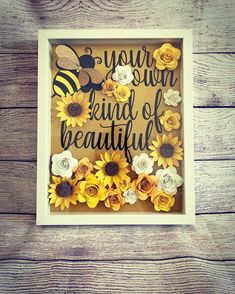 a frame with flowers and a bee on it that says, you're the kind of beautiful