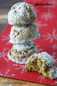 three cookies stacked on top of each other with snowflakes in the back ground