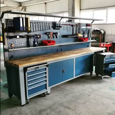 a large workbench with many drawers and tools on the counter top in a garage