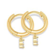 A New Take On Classic Hoops Dainty hoops, robust sparkle.  The perfect addition to your earring stack, The Lacey is an iconic hoop with a twist! Featuring delicate pear cut drop stones and 18k gold plated hoops, these huggies are sure to stand out from the pack.  All earrings are nickel free, come with a Lifetime Warranty, and are guaranteed not to turn your skin green. High Quality & Conflict Free All Modern Gents pieces are nickel free, come with a Lifetime Warranty, and are guaranteed not to turn your skin green. This set of earrings is made of premium 925 sterling silver and is extremely durable to the elements. They are plated with 18k gold and are perfect for girls with sensitive skin. Stones: Conflict Free Simulated Diamonds Material: 925 Sterling Silver with 18k gold plating. Earring Stack, Modern Earrings, Pear Cut, All Modern, Pear, Gold Bracelet, 18k Gold, Gold Plate, Sparkle