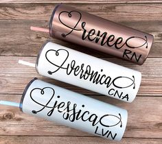 three personalized lip bales are sitting on a wooden surface