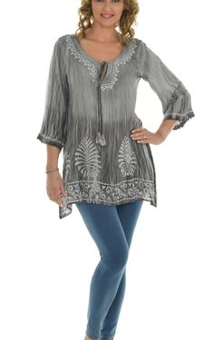 "Add a bohemian feel to your casual ensembles by wearing this long sleeves tunic top crafted with colorful adorable tie-dye and embroidered neckline. Features: * Embroidery on neck and cuff * Tie-dye Ombre pattern * Scoop neck with keyhole * Three-fourth sleeves * Leaf batik print on the hem * Unlined * Pullover * 100% Rayon * Size S: 31\" long from high point of shoulder to hem This tunic top features a beautifully embroidered and hand-dyed tie-dye pattern on rayon. This lightweight and relaxed Bohemian Half Sleeve Blouse For Beach, Bohemian Half Sleeve Beach Blouse, Bohemian Half Sleeve Relaxed Fit Blouse, Bohemian Blouse With 3/4 Sleeves For Summer, Bohemian 3/4 Sleeve Summer Blouse, Bohemian Half Sleeve Tops For Fall, Bohemian Half Sleeve Blouse For Vacation, Bohemian Spring Tops With 3/4 Sleeves, Bohemian Half Sleeve Tops With Relaxed Fit