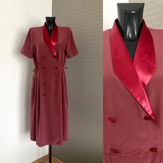 "Women's Burgundy Dress 1970's Vintage Shirtdress Short Sleeves Shawl Collar Dress Button up Smock-style Gown Wrap Closure Dress Size L ♥ Short Sleeves ♥ Romantic Style ♥ Dressing Gown Dress ♥ 4 Button Up 2 roads ♥ Shoulder Pads ♥ Adjustable Waist ♥  2 splits on sides Condition: Vintage Fair: Good Condition. Flaws: Missing Belt Tag: Maxi Materials: No Tags ( Fells like Viscose) Size: On Tag L  Measurements: laying flat and tied closed Length: 125cm = 49,2\" Bust: 108cm =42,5\" Waist: max 96cm = 37,9'' Sleeve length: 28cm - 11'' Shoulder to shoulder: 42cm =16,6'' **Measurements are taken with the garment lying flat. (Some sizes then doubled - Bust, Waist, Hips). Be sure to leave room for movement and comfort** Additional Notes: Please note that due to the nature of vintage clothing, ALL ITE Vintage A-line Dress For Work, Vintage V-neck Midi Dress For Work, Vintage Collared Dress With Buttons, Collared Vintage Dress With Buttons For Vintage Fashion, Collared Vintage Dress With Buttons, Vintage Workwear Dress With Button Closure, Vintage Dress With Button Closure For Work, Retro Vintage Dress With Buttons For Daywear, Vintage V-neck Dress For Workwear