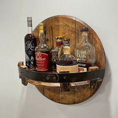 a wooden shelf with liquor bottles on it