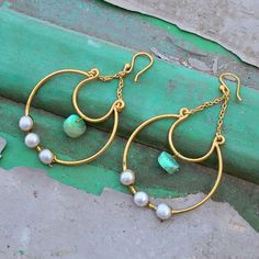 GemFormingStudio D E T A I L S Gemstone : Pearl Earring Length  : 55 mm Stone Size     : 10 mm      Weight           : 10 gm Material         : Brass Freshwater Pearl Gemstone Earrings \ Brass Jewelry \ Hook Earrings \ Dangle Earrings \ Statement Earrings \ Wedding Earrings \ Boho Earrings . Contact us for wholesale prices. R I N G S https://www.etsy.com/in-en/shop/GemFormingStudio?section_id=22783374 B E A D S https://www.etsy.com/in-en/shop/GemFormingStudio?section_id=22828835 W A N D S https://www.etsy.com/in-en/shop/GemFormingStudio?section_id=22997040 C H A R M S https://www.etsy.com/in-en/shop/GemFormingStudio?section_id=23027116 B A N G E L S https://www.etsy.com/in-en/shop/GemFormingStudio?section_id=22816494 P E N D A N T S https://www.etsy.com/in-en/shop/GemFormingStudio?section_ Wedding Wire Wrapped Metal Earrings, Handmade Metal Dangle Bridal Earrings, Wire Wrapped Dangle Hoop Earrings For Wedding, Handmade Metal Drop Bridal Earrings, Handmade Metal Bridal Drop Earrings, Wire Wrapped Drop Earrings For Wedding, Bohemian Pearl Wedding Earrings With Ear Wire, Dangle Brass Pearl Earrings, Dangle Pearl Earrings With Brass