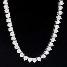 An incredibly rare find for a tennis necklace with this much firepower from designer Roberto Coin. A long, sparkly row of round brilliant diamonds is set in 3 martini prongs for maximum brilliance on the neck, making for the perfect necklace to wear during both day and night. Understated enough to wear by day, yet offers enough drama to pair with that LBD. 18kt White Gold 18.5" in length Diamonds are estimated to be G/H colors & VVS/SI1 clarities. GIA Standards Please see qualitative report for Modern Mens Rings, Diamond Tennis Necklace, Piece Sign, Jewel Necklace, Roberto Coin, Tennis Necklace, Fancy Jewelry, Mens Band, Vintage Band