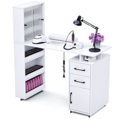 a white desk with drawers and a lamp