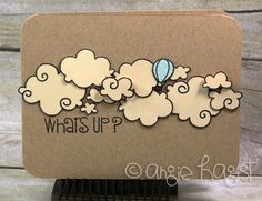 a card with an image of clouds and a hot air balloon that says, what's up?