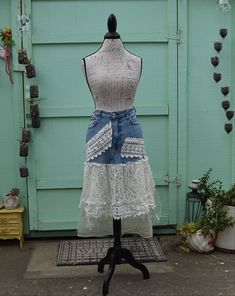 Up-Cycled Abercrombie & Fitch Off White/Cream Lace, Ribbon Western, Wedding Festival, Event Unique One of A Kind Blue Denim Jean Skirt This skirt is made from a pair of women's Abercrombie & Fitch blue denim jeans size 27/4s. The mannequin has a 27 inch waist, it was a tight fit.  I added vintage lace, lace pieces cut from a poncho, buttons, pearls, seed beads, netting, braid trim and lace tablecloth. I have collected it all from various places.   Laying flat the waist measures approx. 28/29 inches around, the zipper and pockets are functional. The longest lace ribbons measure approx. 33 inches including the denim. The tablecloth and netting can be cut to scallop or keep it squared.  Each of the pieces is sewn separately to the base skirt. It will need to be taken out of the shipping packa Spring Fitted Upcycled Skirt, Denim Jean Skirt, Lace Tablecloth, Western Wedding, Pinterest Closet, Lace Ribbon, Festival Wedding, Cream Lace, Jean Skirt