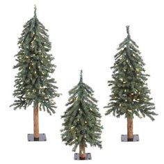 three artificial christmas trees with lights on them