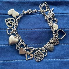 Shiny And Recently Polished This Authentic James Avery Heart Charm Bracelet Dazzles! Expect To Be Stopped As Others Admire Your One Of A Kind Collection Of Hearts When They See And Hear The Soft Swish Of Charms Encircling Your Wrist. Hurry, With Valentine's Day Fast Approaching, This One Of A Kind Bracelet Won't Last Long! Featuring 16 Charms, 15 Stamped With The James Avery Logo, Marked 925 Or Imprinted With The Designer’s Name, 1 Charm Is Not James Avery- It Is The Puffy Heart On The Left Side Of The Photo. Includes Rare And Retired Charms! Non-Detachable Safety Chain Included. Secure Working Clasp, Stamped Avery, 925. Measures Approx 7.5” Around With Claps Closed. Measurements A James Avery Charm Bracelet, Pandora Bracelet Charms Ideas, James Avery Charms, James Avery Jewelry, Bracelet Charms, Pandora Bracelet Charms, James Avery, The James, Safety Chain