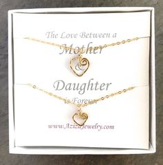 This Gold Hearts Necklace Set is just for your favorite mother-daughter duo. These matching 14k gold filled heart necklaces make the bond between mother and daughter even more special. "The love between a mother and daughter is forever."DETAILS:Two swirly heart necklaces are hand formed from 14k gold filled wire into the shape of hearts and then hammered for texture and shine. The larger heart measures about 1/2 inch wide while the smaller heart measures a little more than 1/4 inch wide. Each se Mother's Day Double Heart Birthstone Necklace, Mother's Day Double Heart Necklace With Heart Beads, Double Heart Charm Necklace For Mother's Day Anniversary, Dainty Heart Necklace With Birthstone For Mother's Day, Mother's Day Heart Pendant Charm Necklace For Anniversary, Heart Pendant Charm Necklace For Anniversary And Mother's Day, Double Heart Charm Necklaces For Mother's Day Anniversary, Heart Pendant Charm Necklace For Mother's Day Anniversary Gift, Heart Pendant Charm Necklaces For Anniversary And Mother's Day