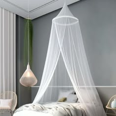 a bed with a white net hanging from the ceiling